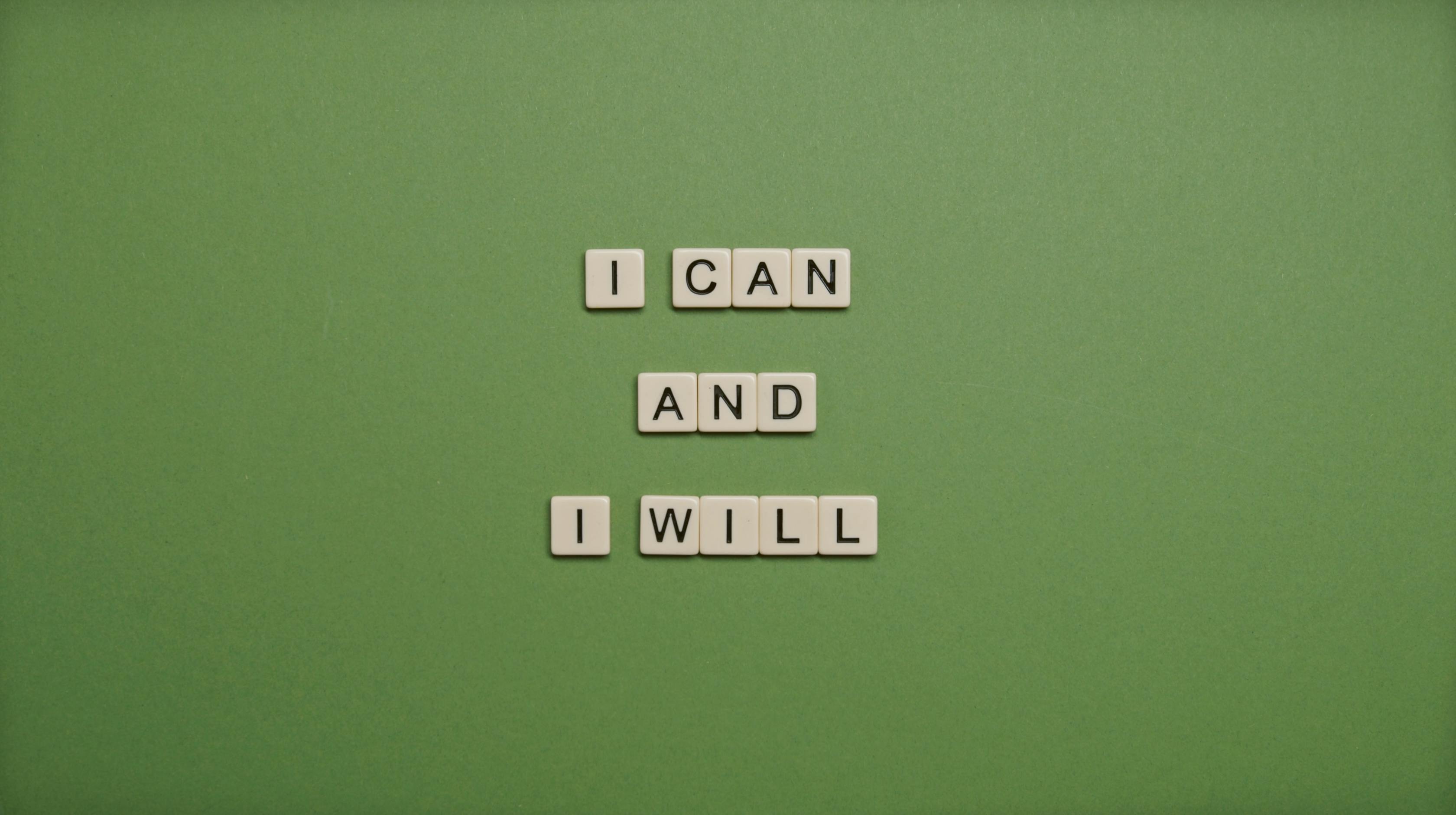 Personal Development. Scrabble tiles forming the words I Can and I Will.